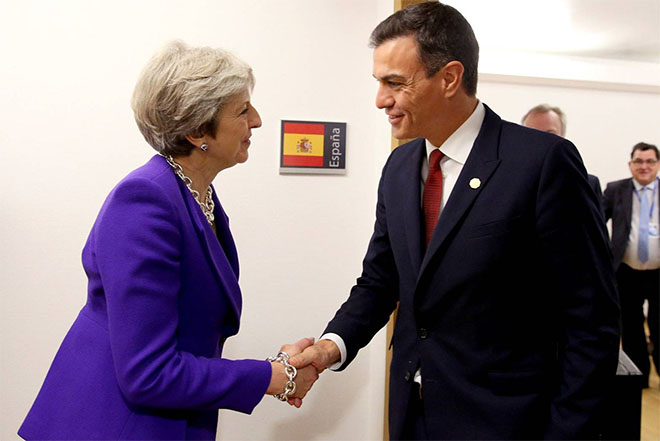 Theresa May greeting with handshake