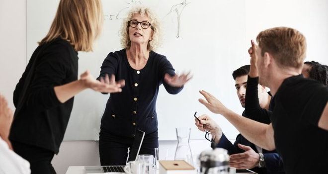 People angry in a workplace meeting